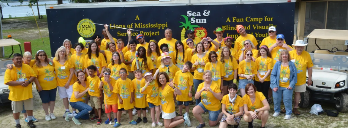 Group of 30 campers wearing yellow t-shirts.