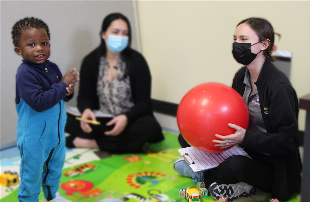 Child having fun with two scholars