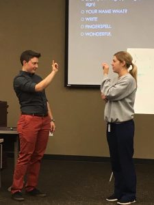 Students learn ASL: Fingerspell