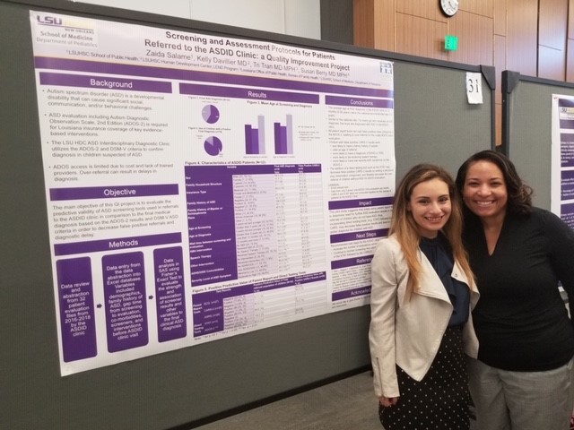 Zaida Mireya Salame and Kelly Davillier with poster about HDC ASDID clinic, LSU Pediatric Research Day, May 2019